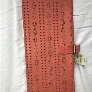 A casual coral clutch